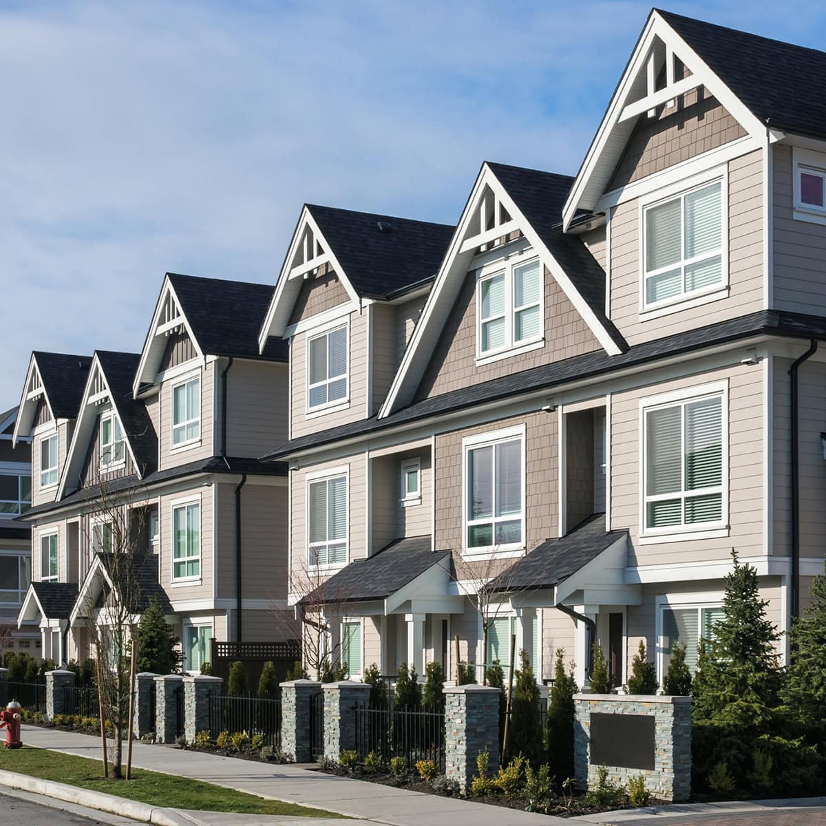 A row of gray townhouses